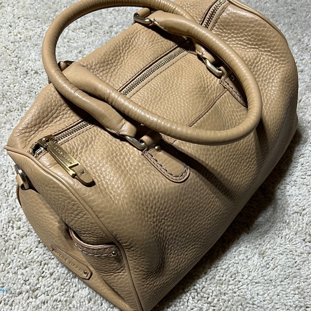 Cole Haan barrel roll bag. Tan pebbled, leather, excellent quality and condition